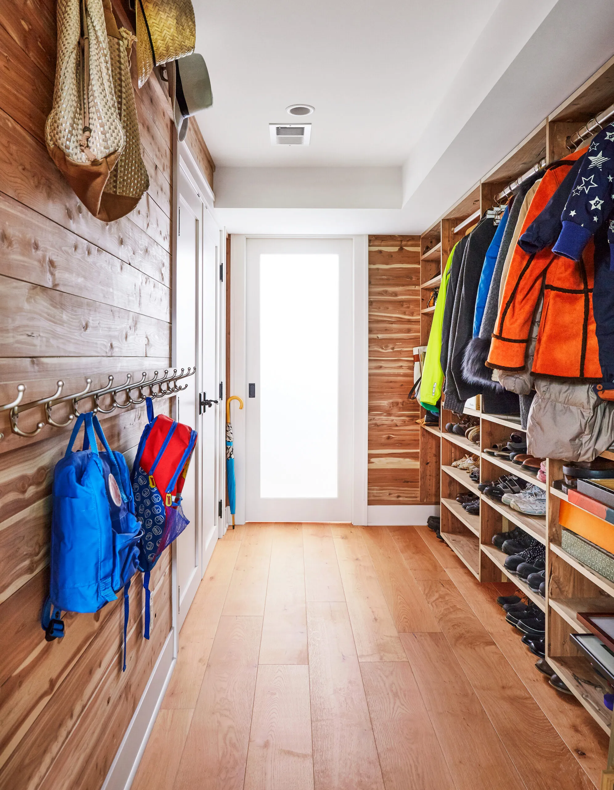 A mudroom with built-in cubies for shoes.