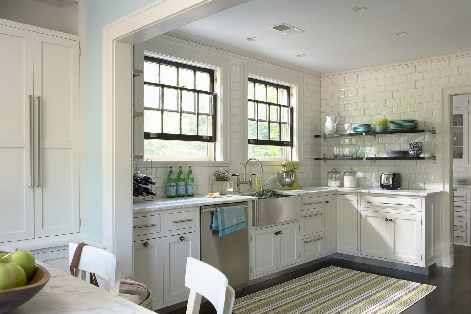 A kitchen with a stainless steel sink.