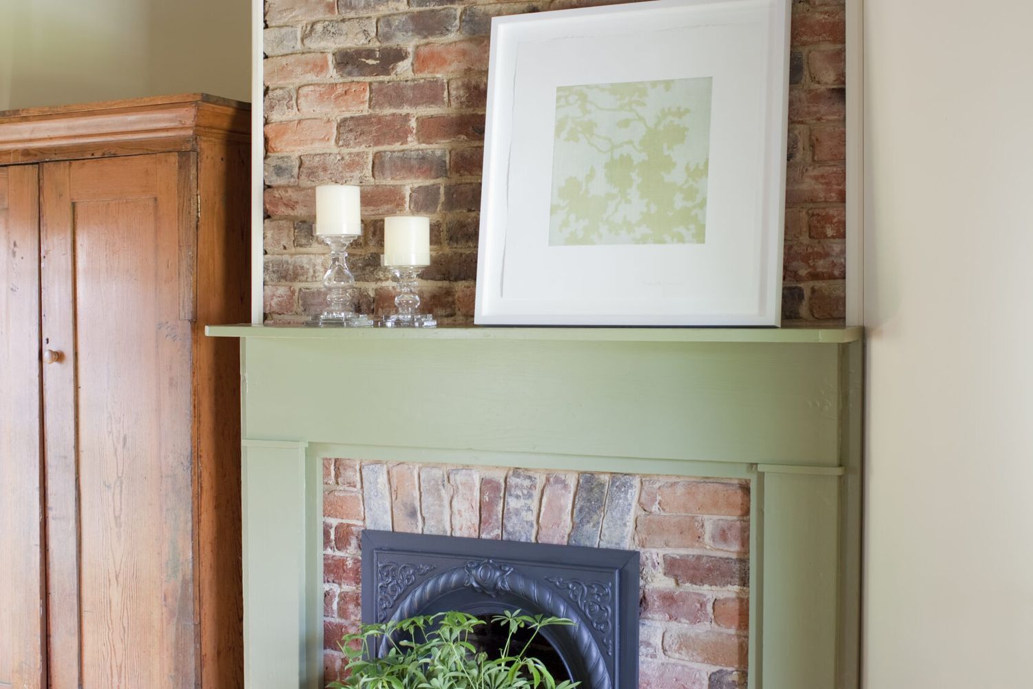 Fire place with a hearth painted using green milk paint.