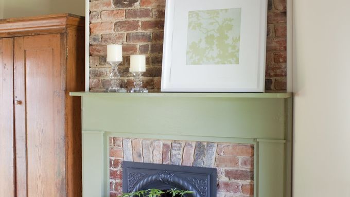 Fire place with a hearth painted using green milk paint.