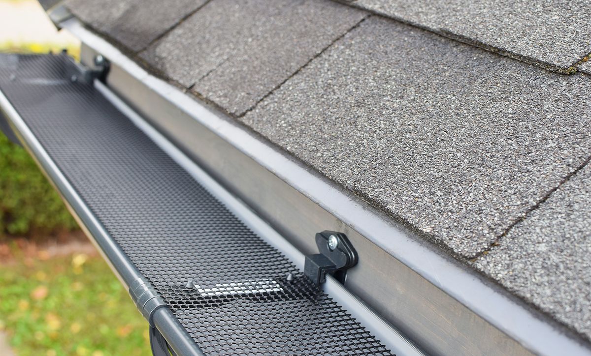 A gutter guard installed on the roof of a home.