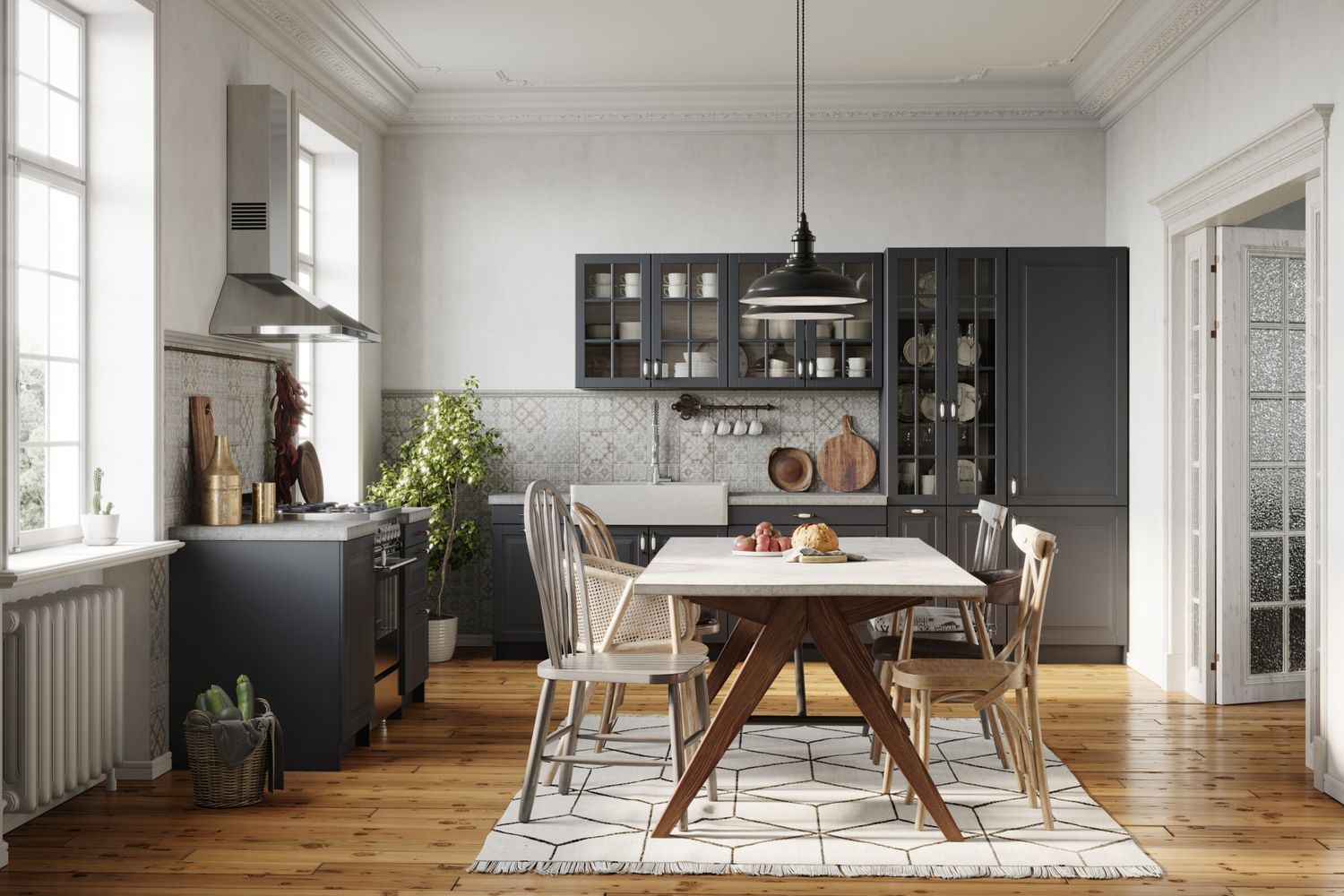A kitchen with hardwood flooring and large windows.