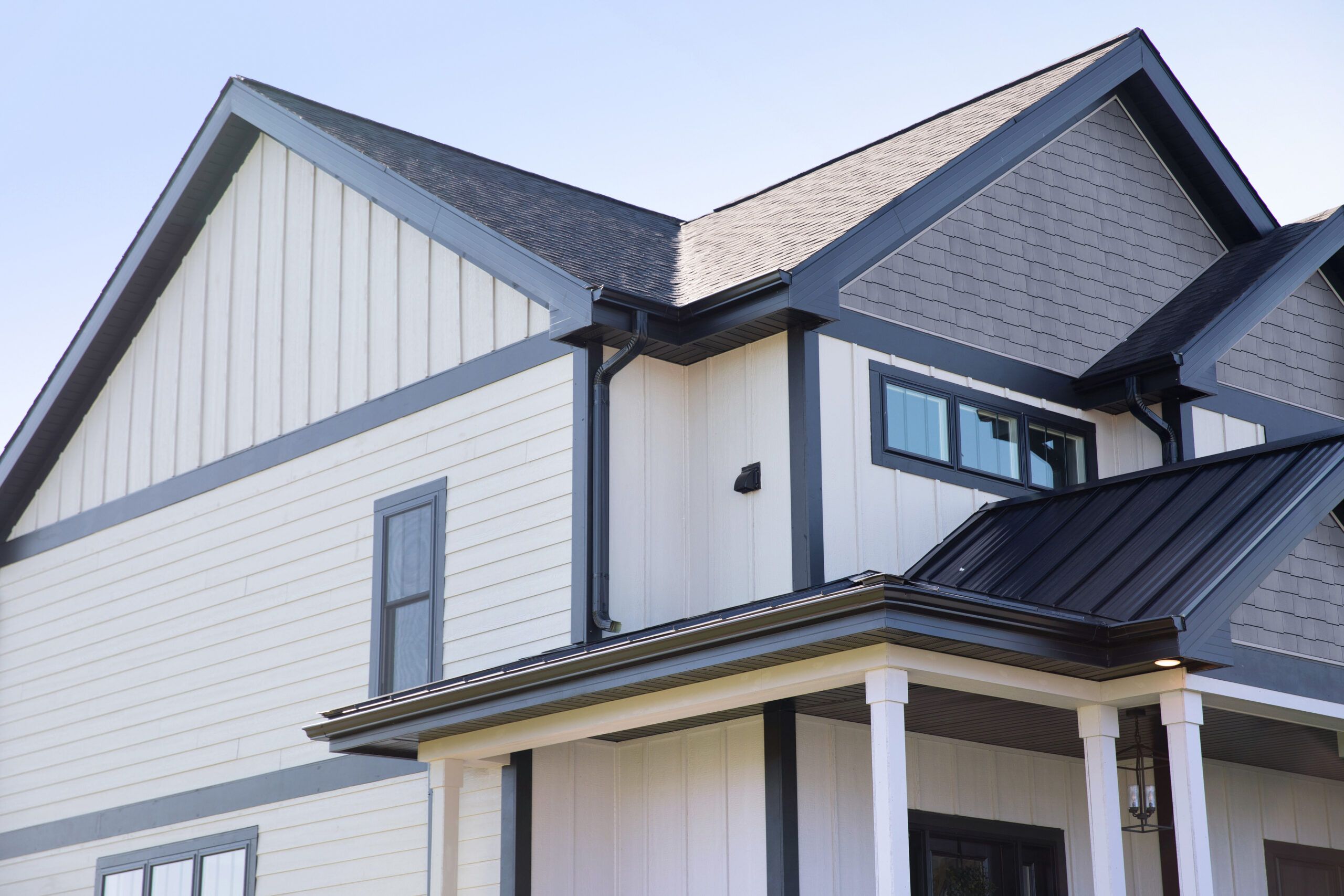 A house with black and white color contrasting siding.