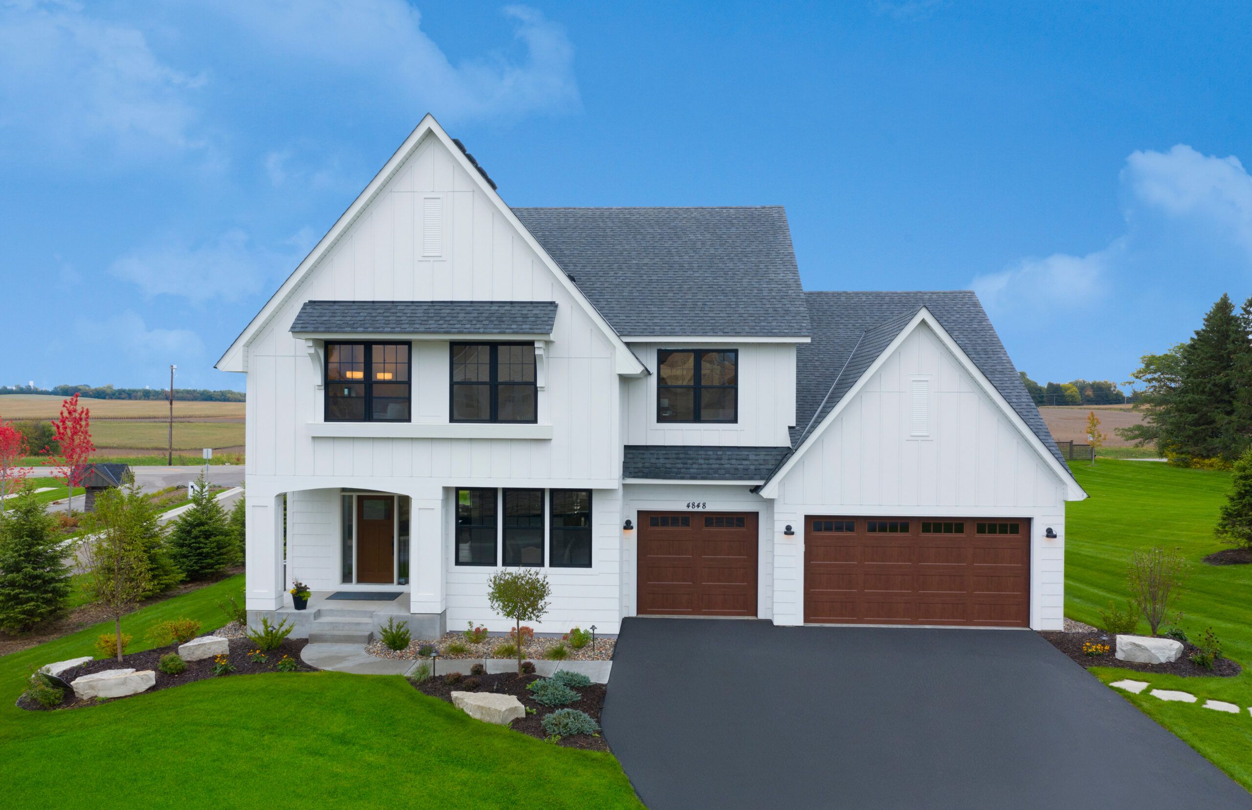 A house with white engineered wood siding.