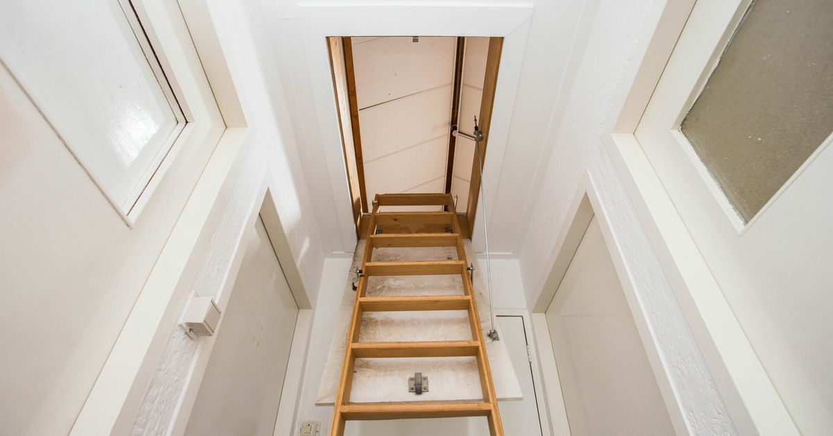 An insulated pull down steps style attic door.