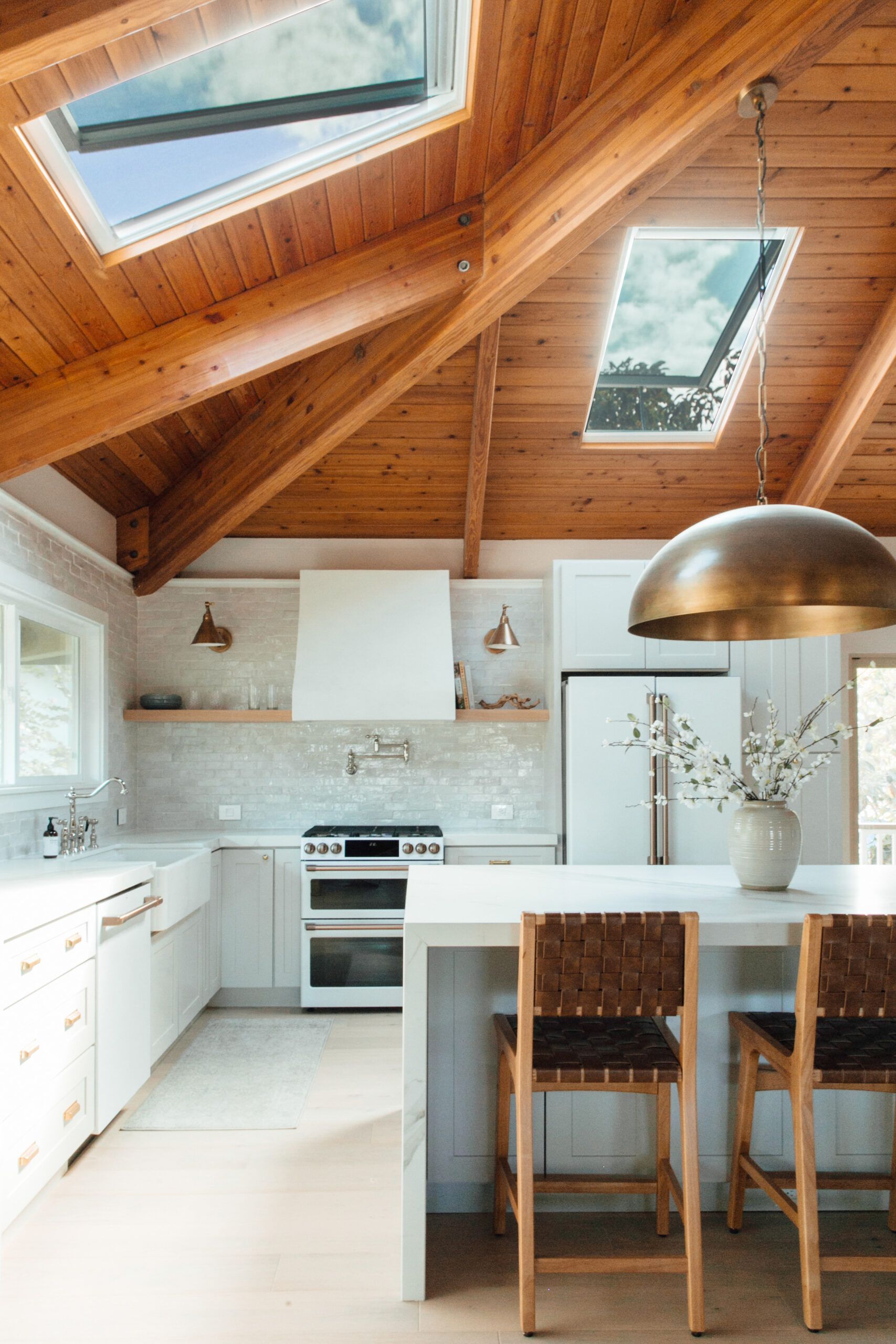 Kitchen with wooden ceiling and sky-lighting