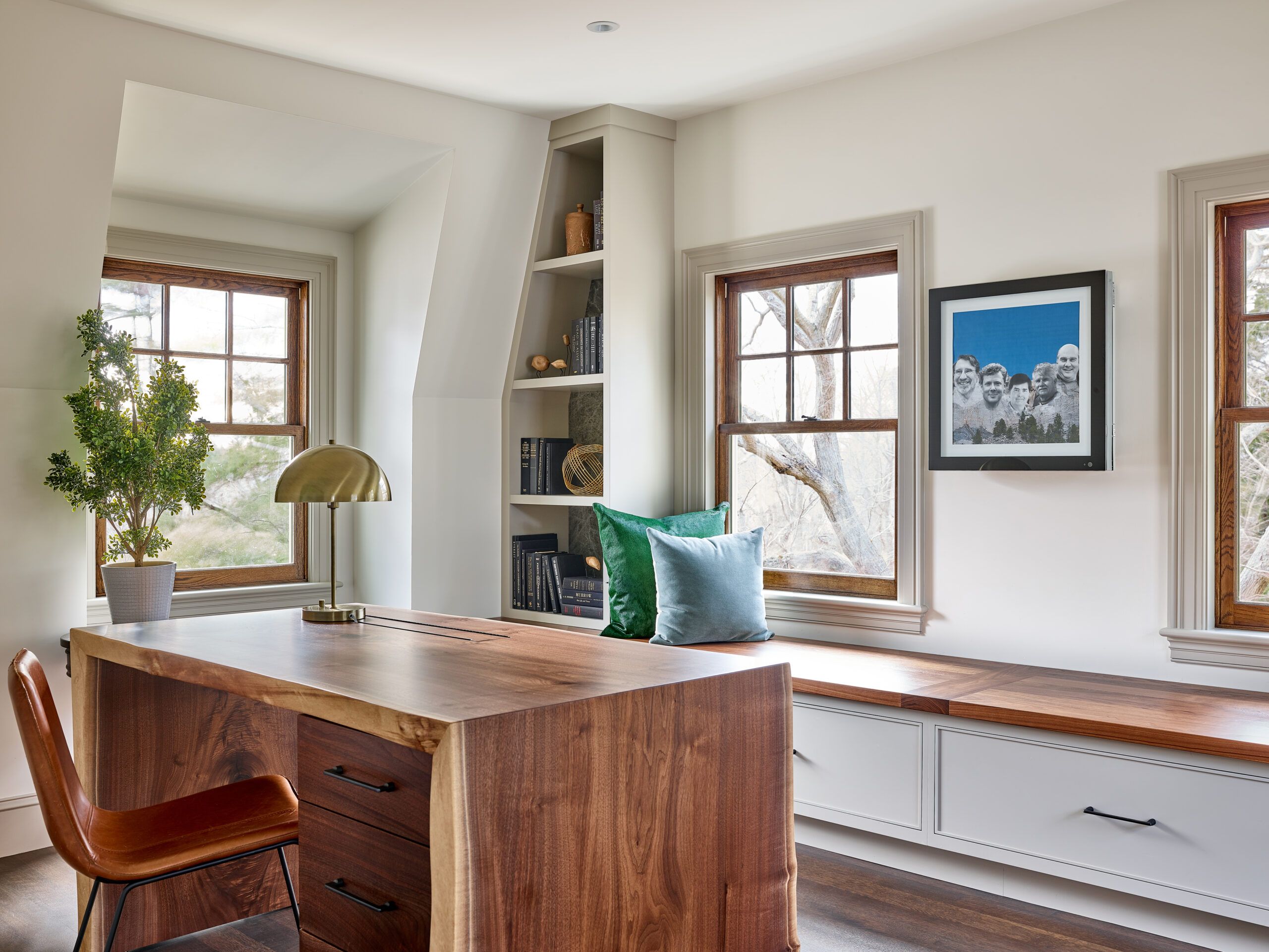 Image of a wooden kitchen countertop with a live-edge which preserves the natural contour of the tree