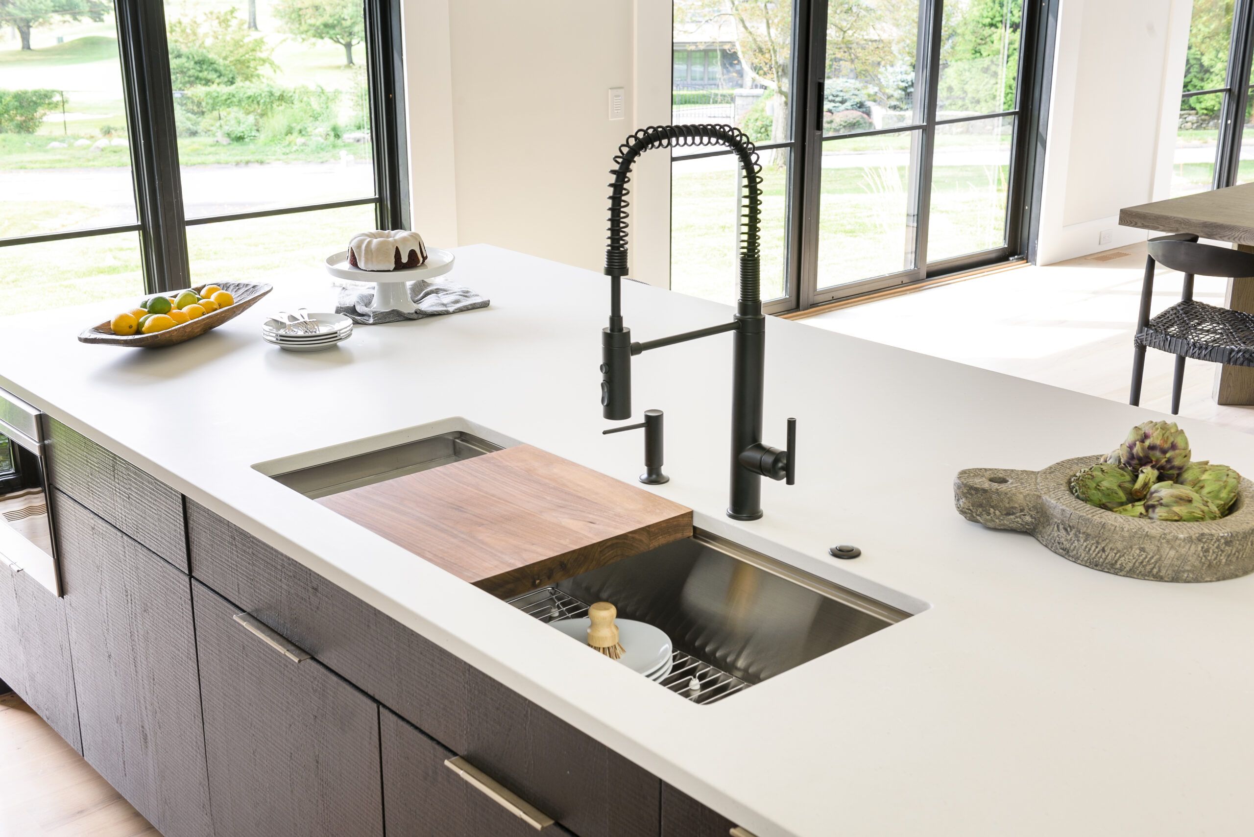 Image of a kitchen with a matte white countertop which provides a modern aesthetic