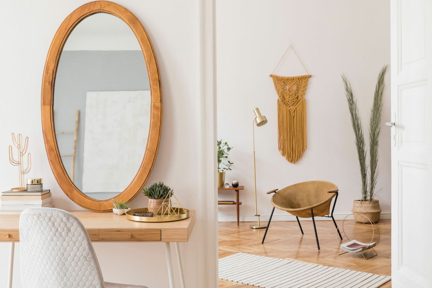 Glass mirror cut into an oval shape and set in a wooden frame.