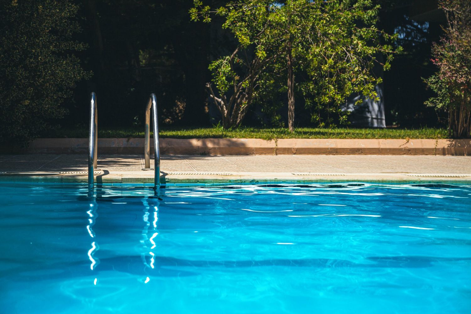 A pool filled with water to be drained.