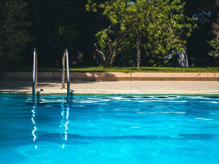 A pool filled with water to be drained.