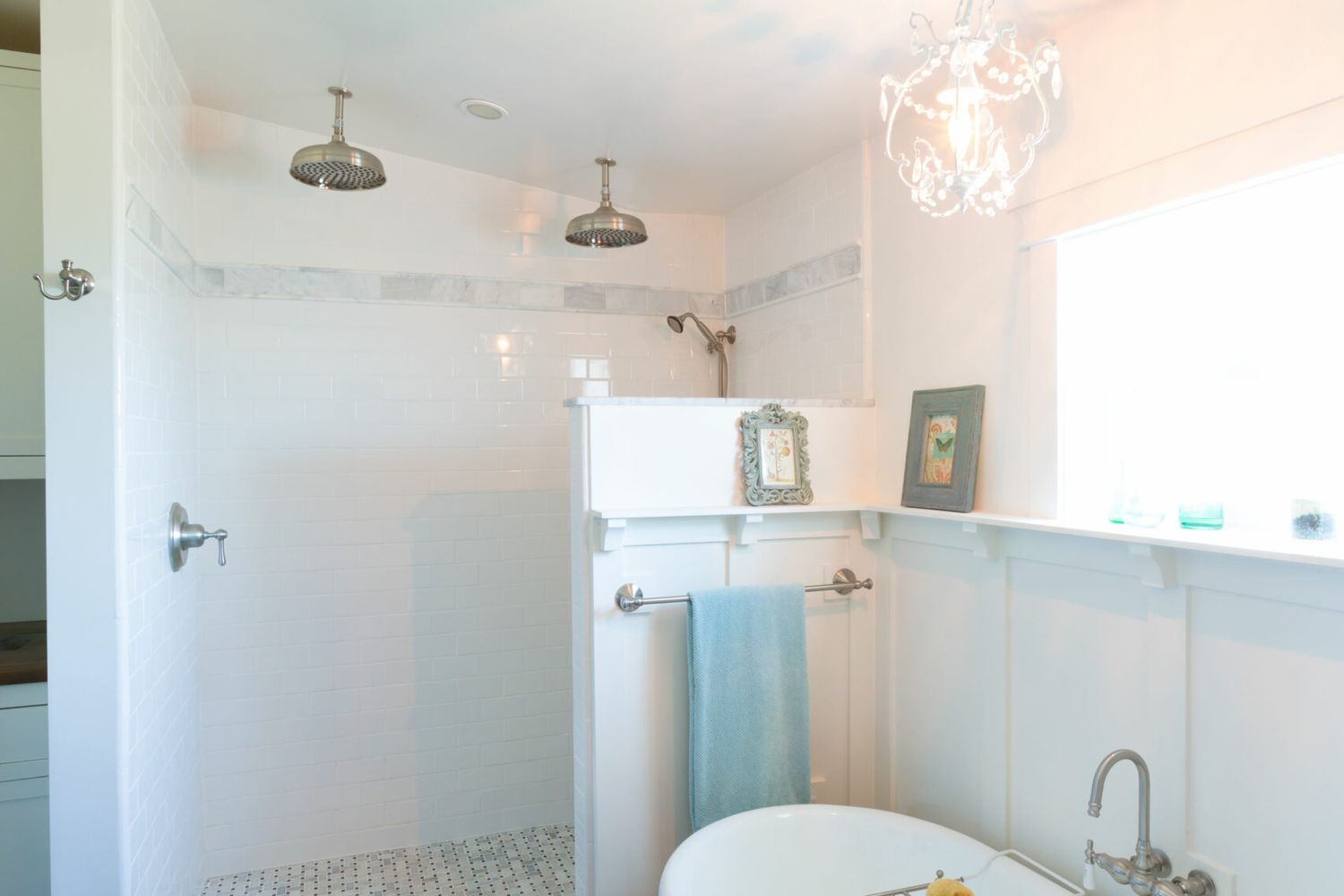 A bathroom with a bathtub on the right side and a shower against the back wall.