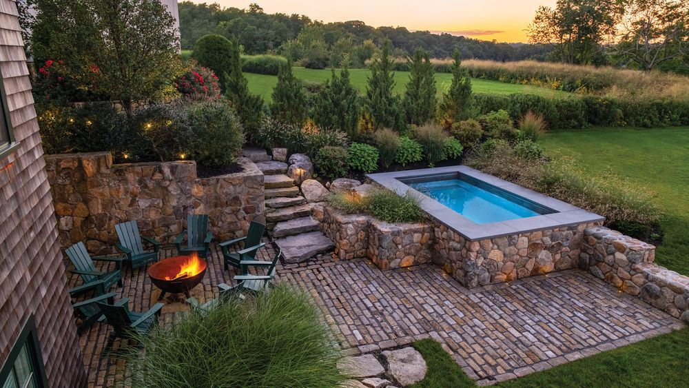 Plunge pool in a landscaped backyard.