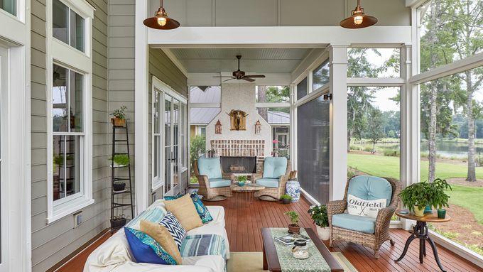 Screened in porch with a coastal design scheme.