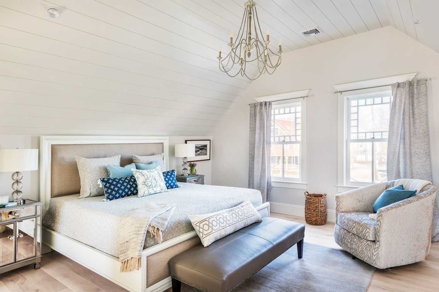 A bedroom with shiplap walls.