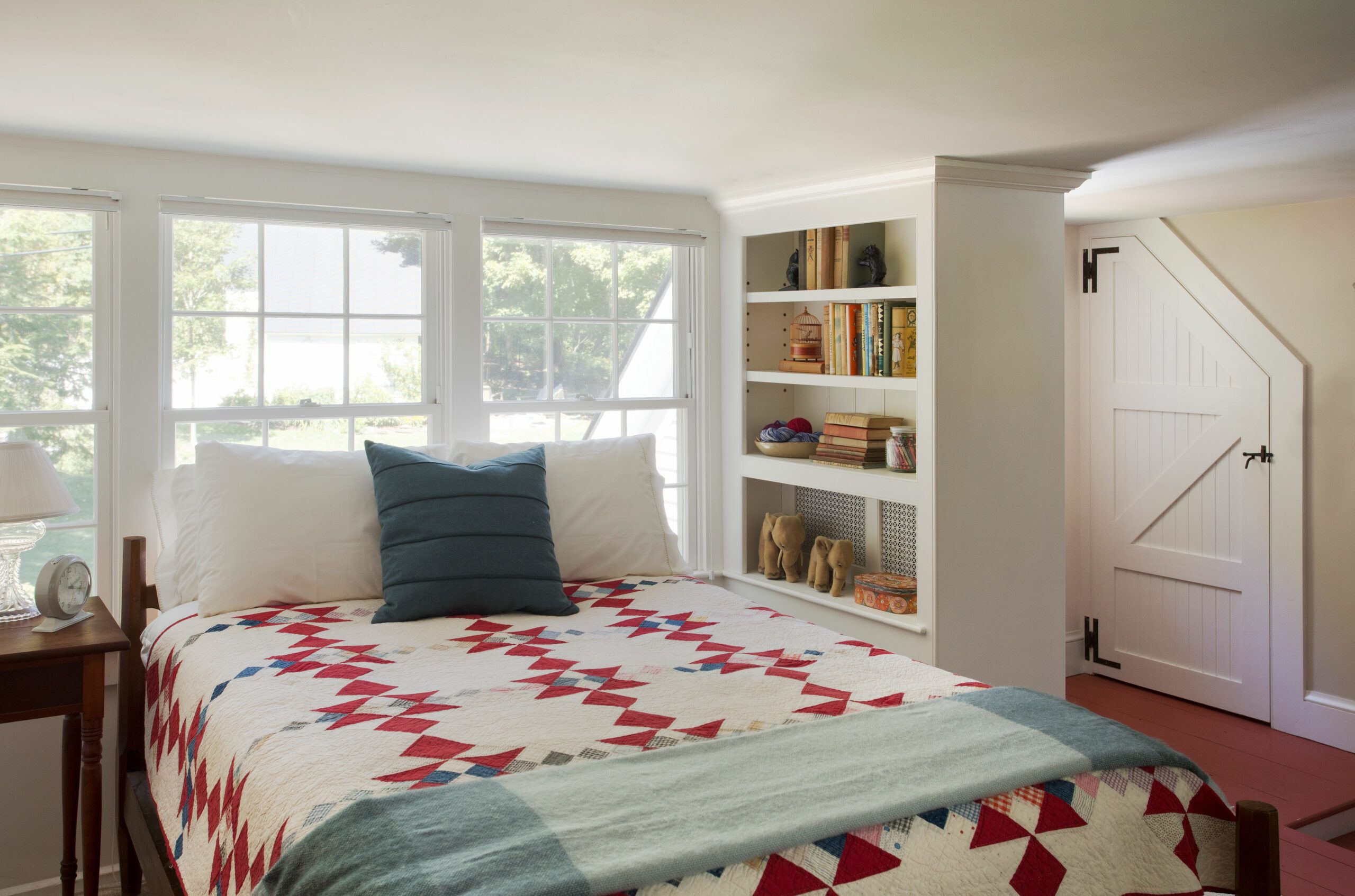 A bookshelf with shiplap backing.