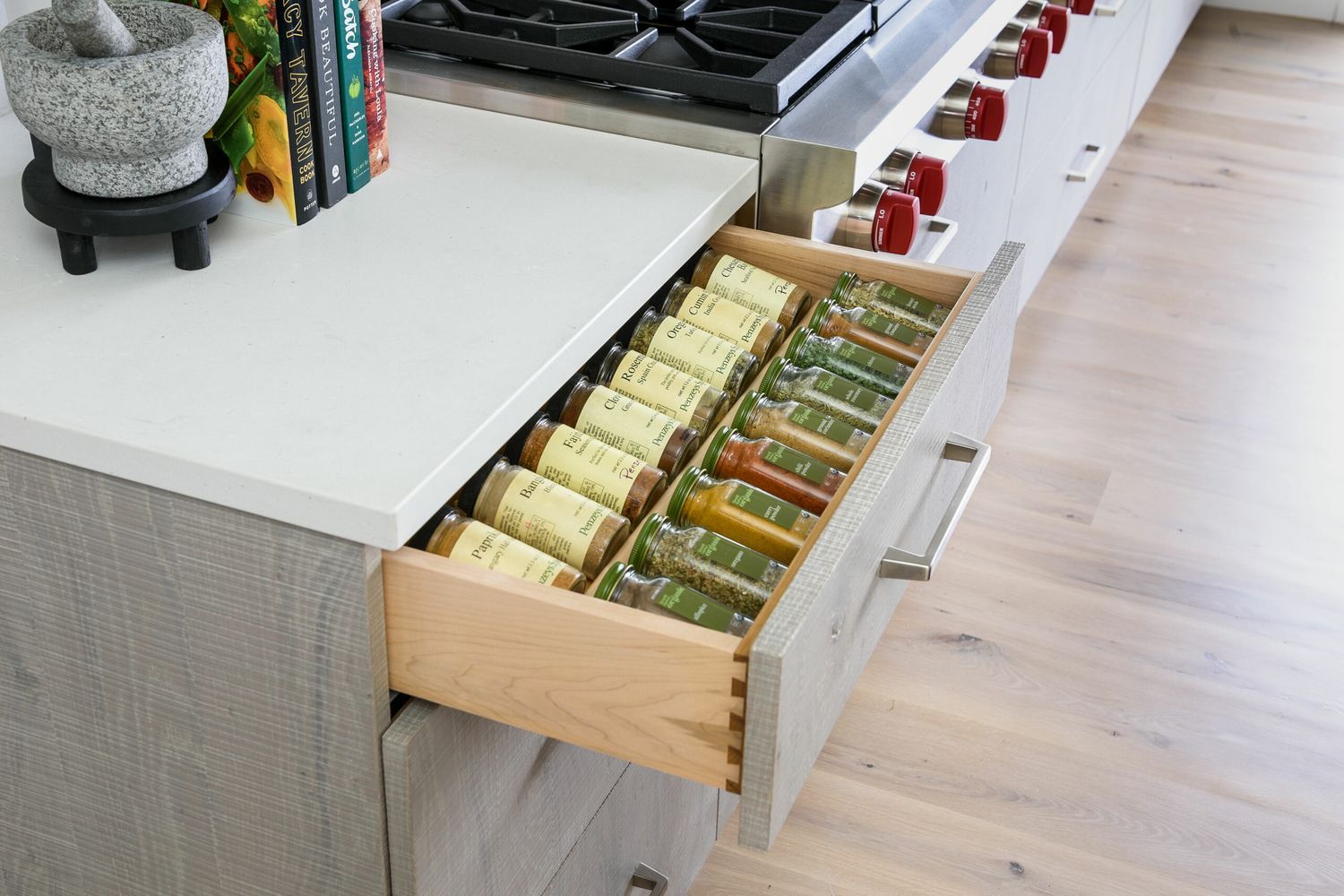 A spice drawer in a kitchen.
