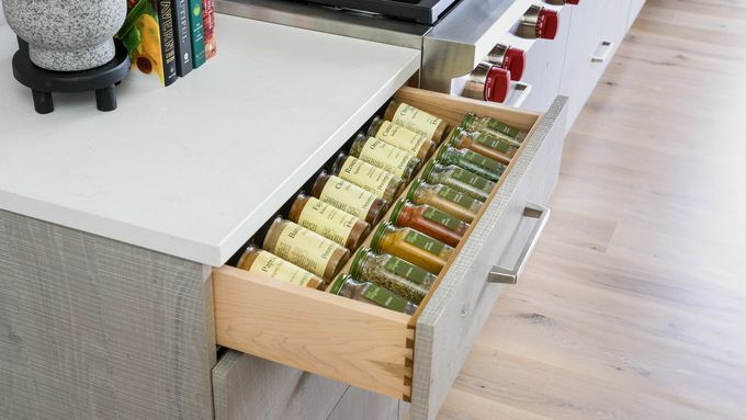 A spice drawer in a kitchen.