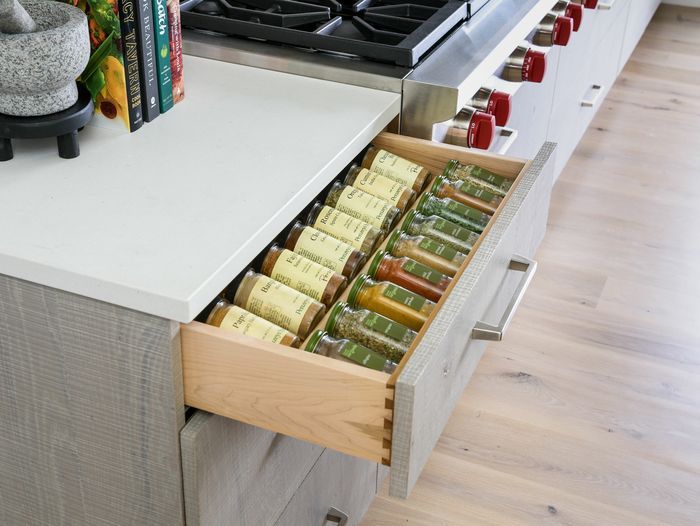 A spice drawer in a kitchen.