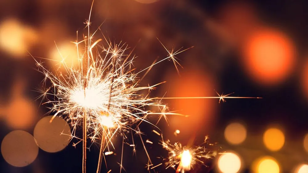Image of sparklers being used to celebrate an occasion. It is important to learn home fireworks safety when using sparklers and fireworks.