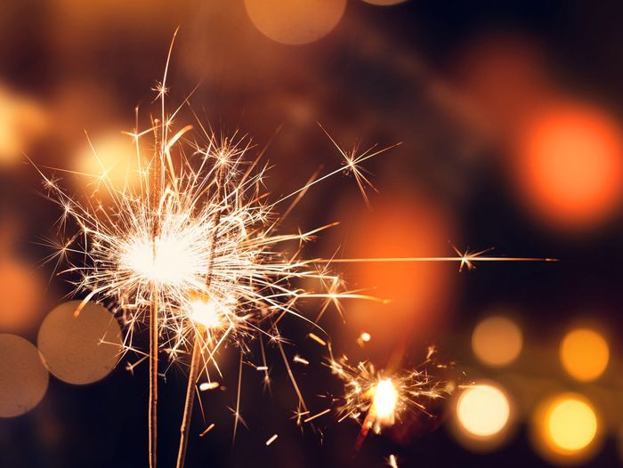 Image of sparklers being used to celebrate an occasion. It is important to learn home fireworks safety when using sparklers and fireworks.