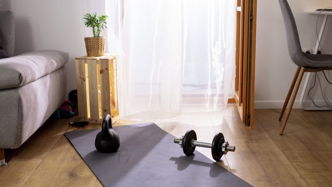 Image of a small home gym. There are creative ideas in our guide on how to store items in your home gym.