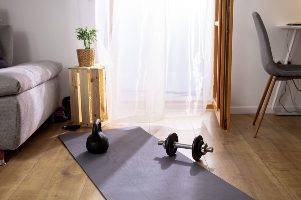 Image of a small home gym. There are creative ideas in our guide on how to store items in your home gym.