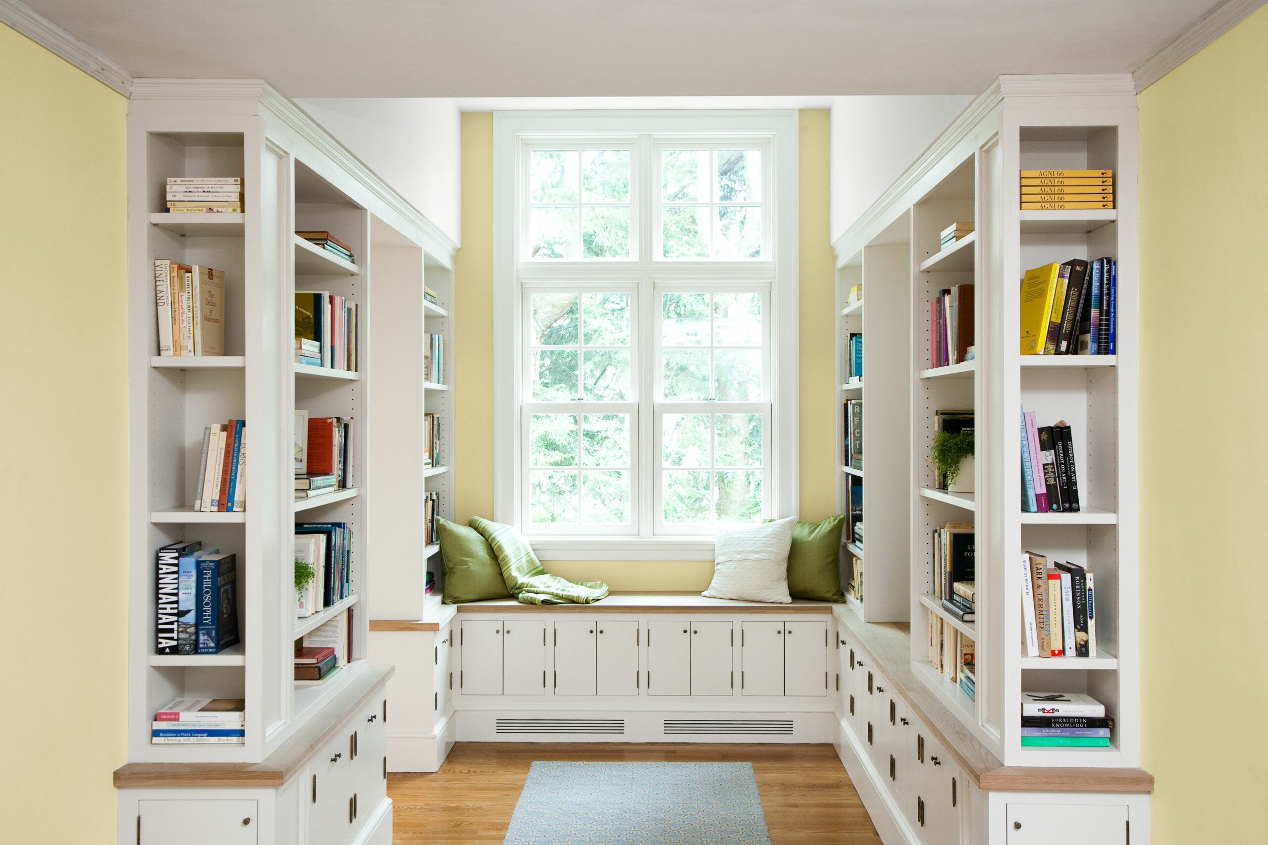 A cozy and inviting home library with floor-to-ceiling bookshelves