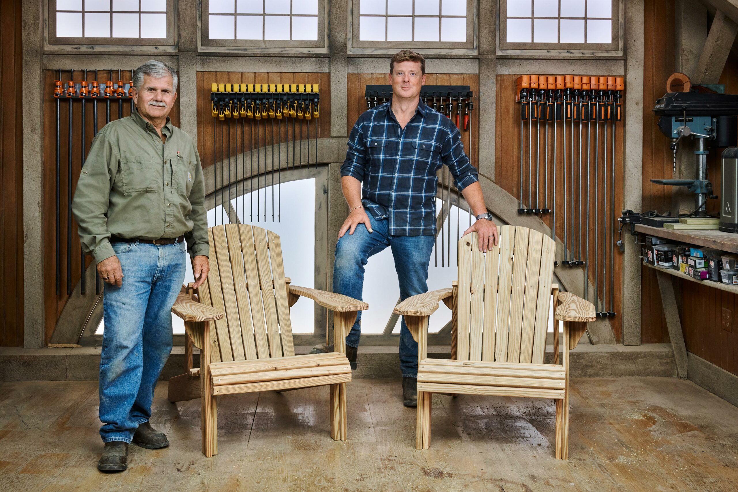 two adirondack chairs with the guys who built them