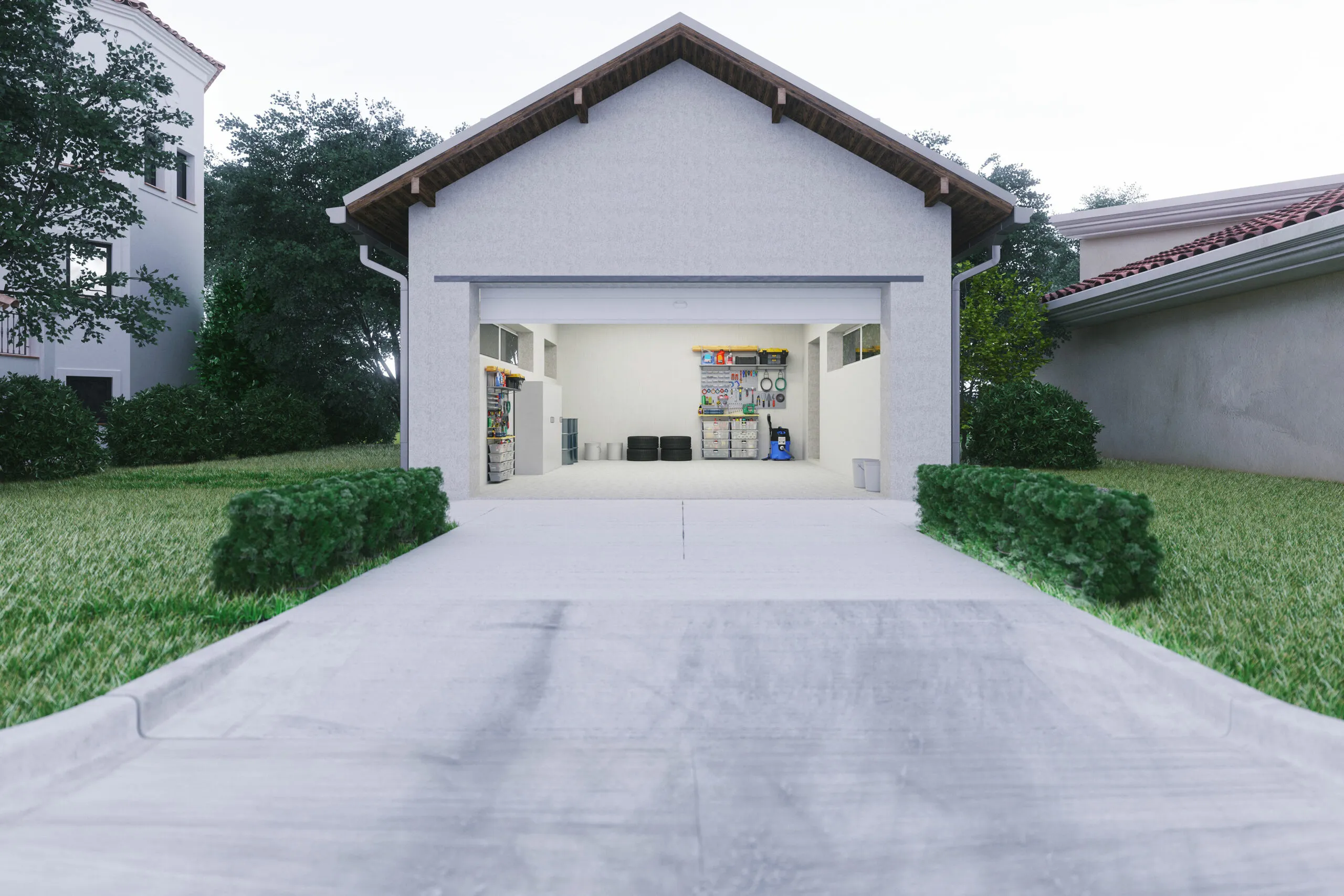 Concrete driveway leading up to a open garage.