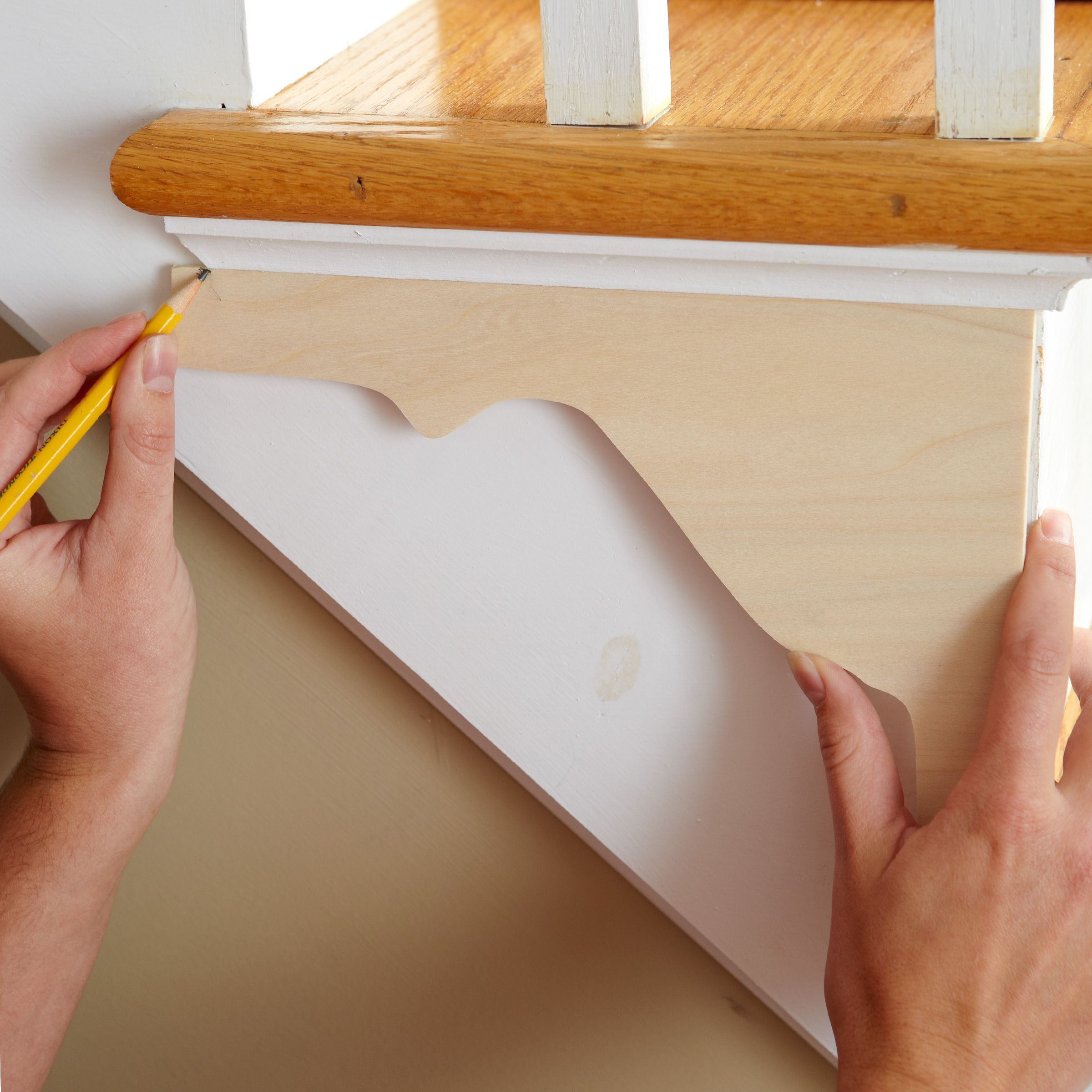 tracing the bracket onto the side of the stair