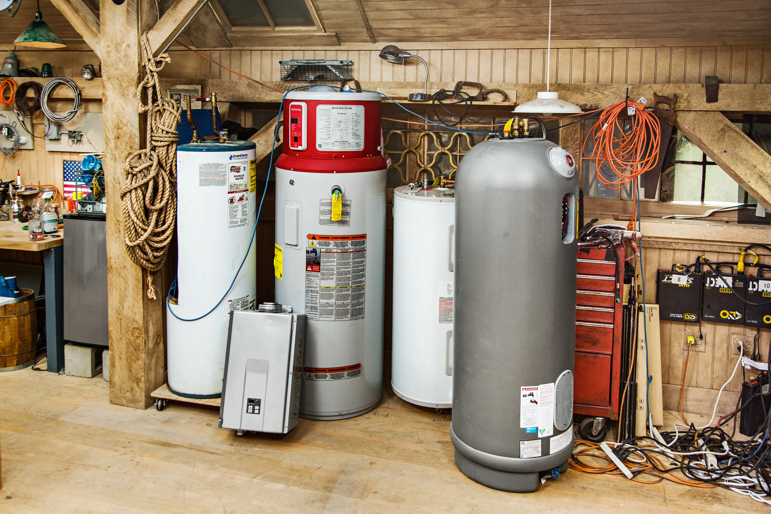 Different types of hot water heaters in a workshop.