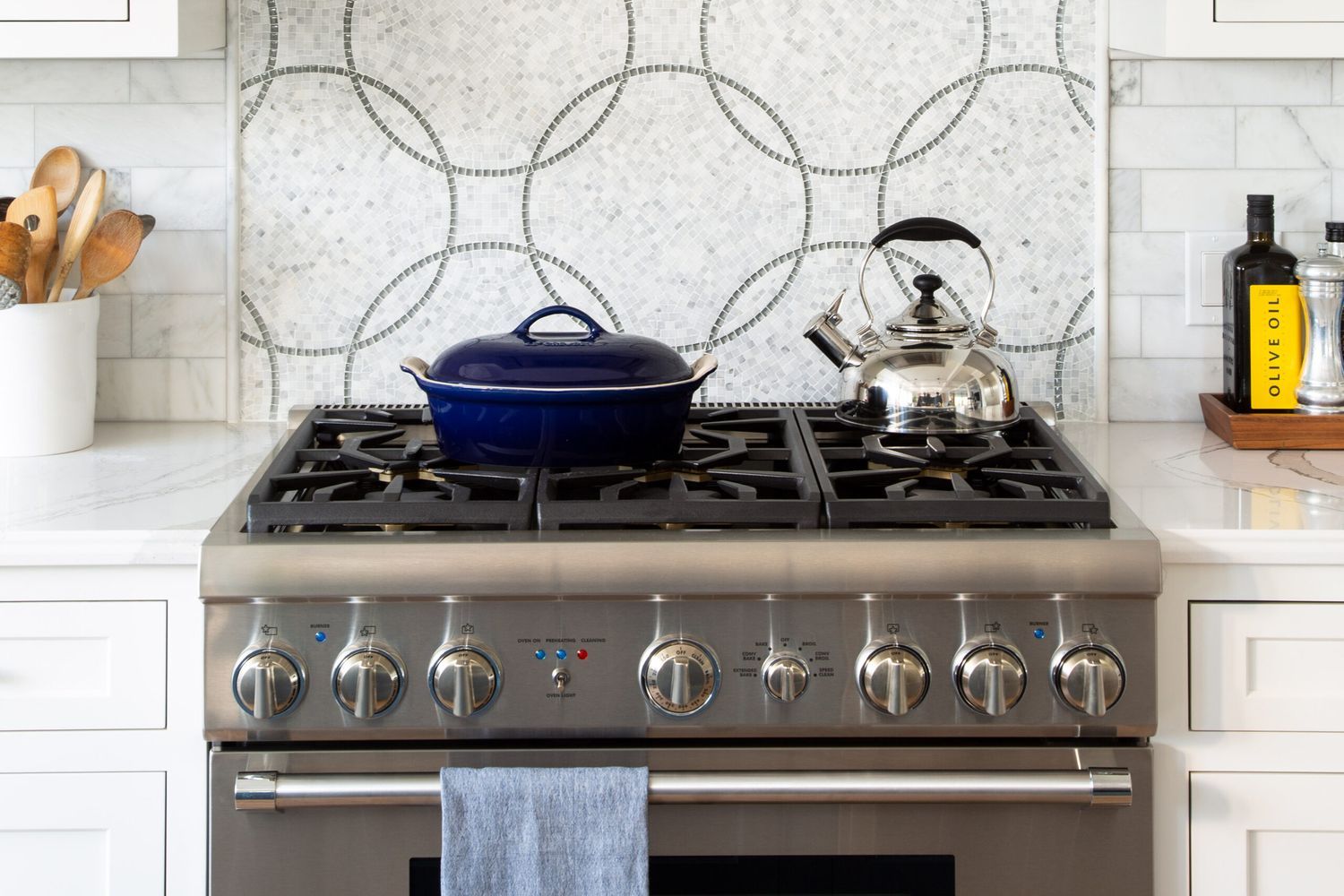 A pot and kettle on a clean kitchen stovetop