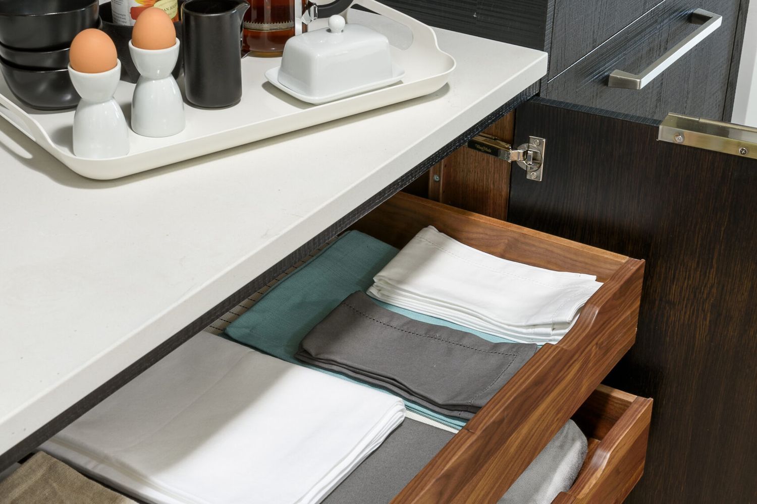 a finished pull-out kitchen shelf within a cabinet