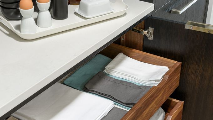 a finished pull-out kitchen shelf within a cabinet