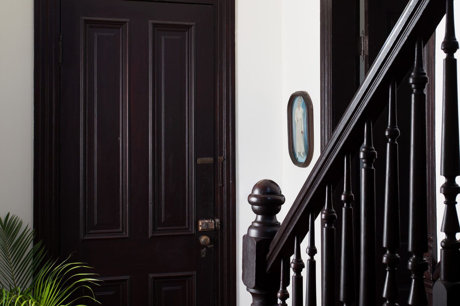 A stairway with antique newels at the bottom.