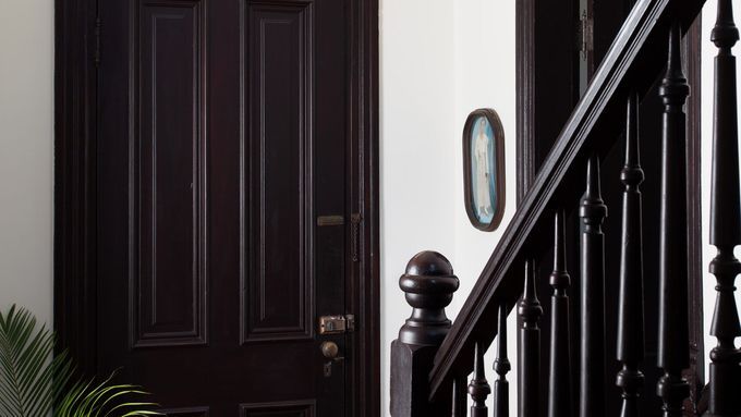 A stairway with antique newels at the bottom.