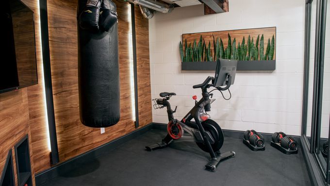 A home gym in a basement storage room.