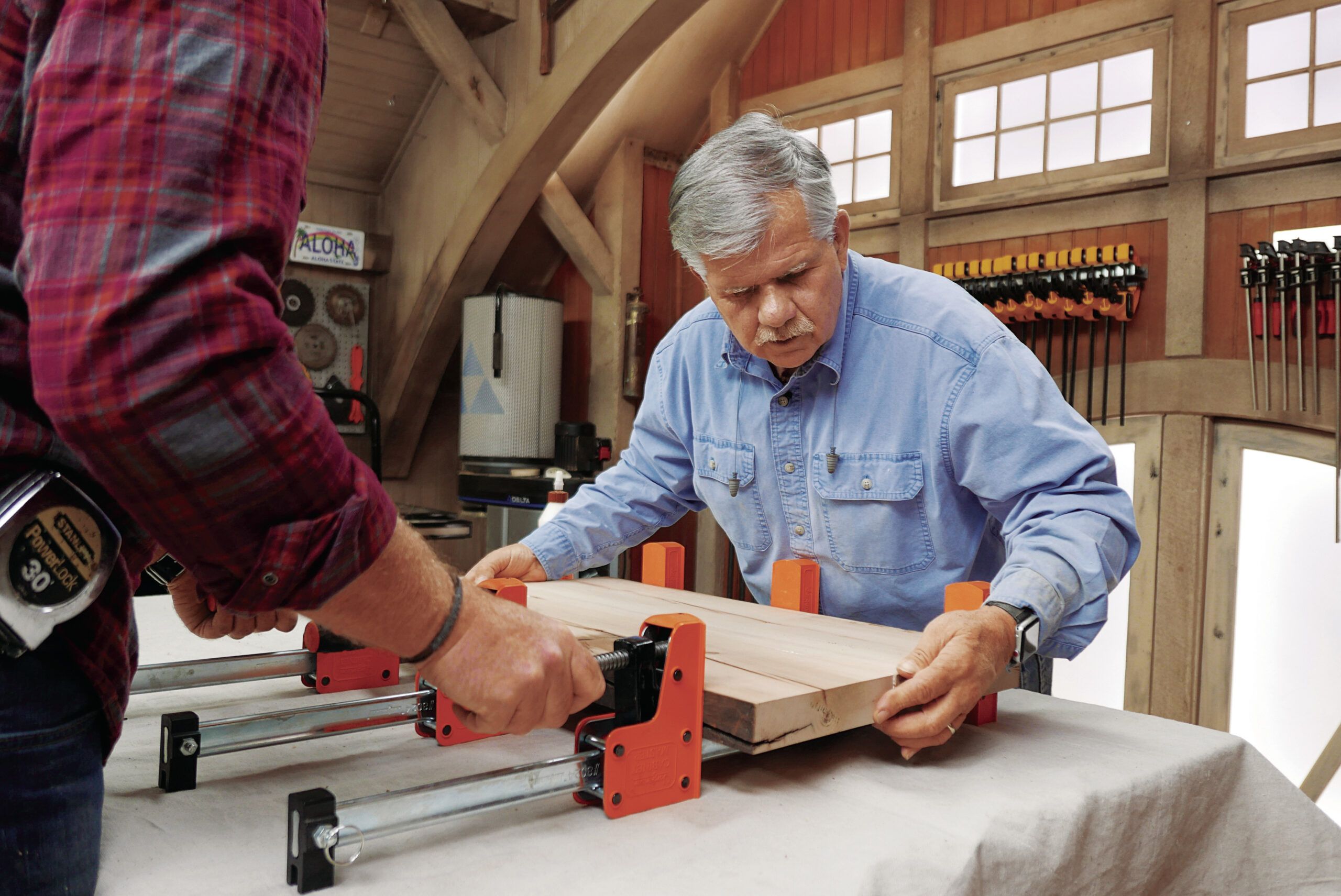 Tom Silva edge-gluing and clamping two pieces of wood  together