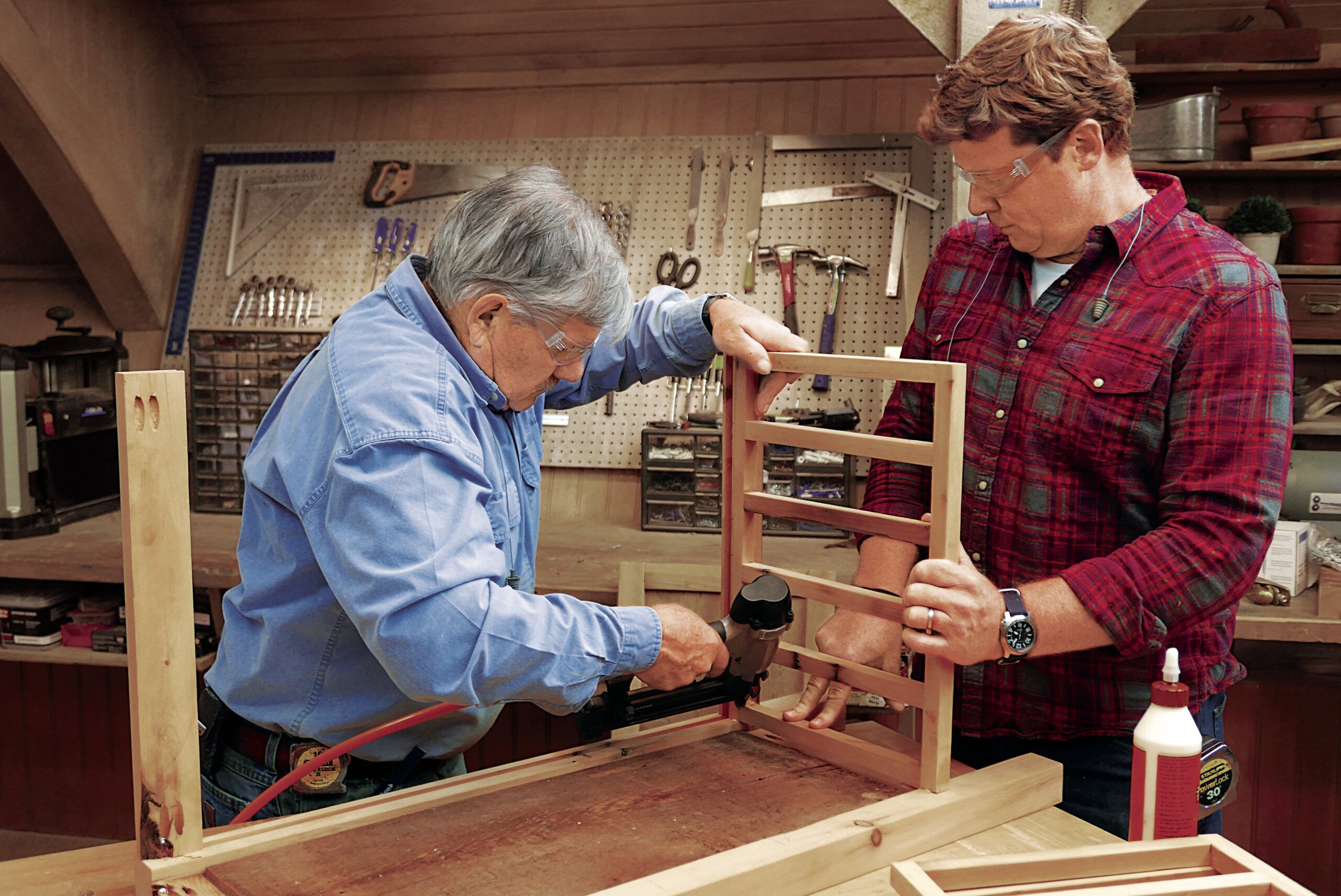 Tom Silva attaching the bottle racks