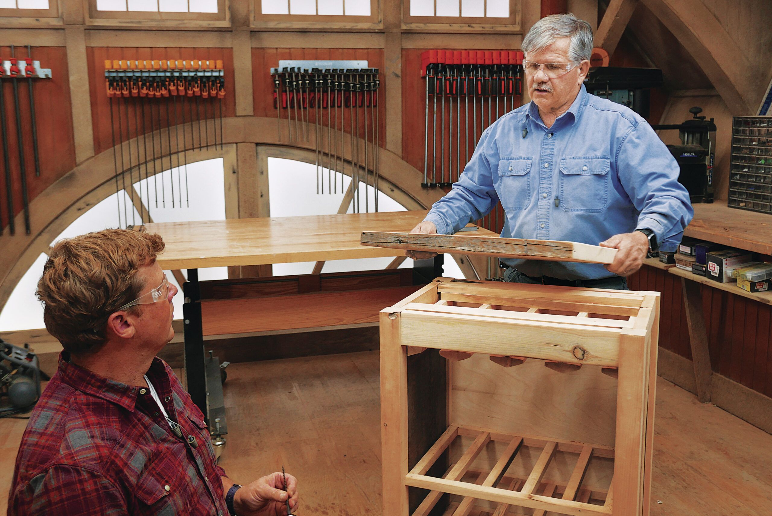 Tom Silva attaching the top to the cabinet