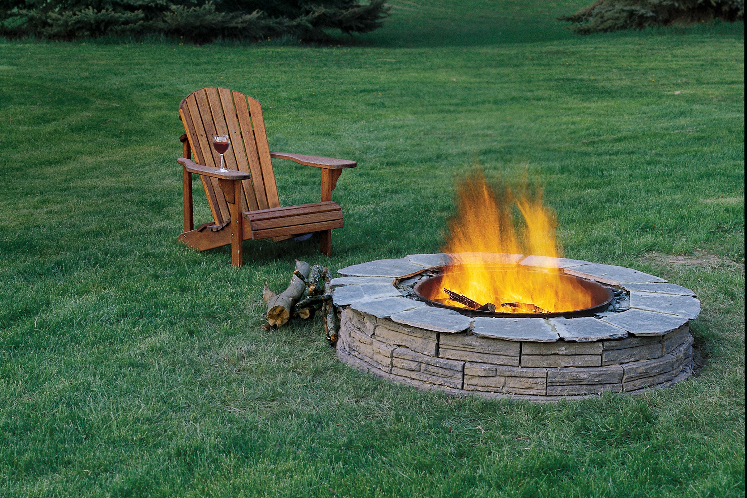 A fire pit and a chair 