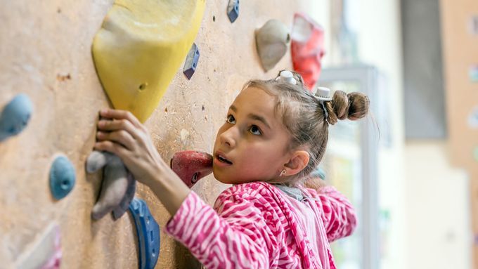 A child climbing a rock wall.