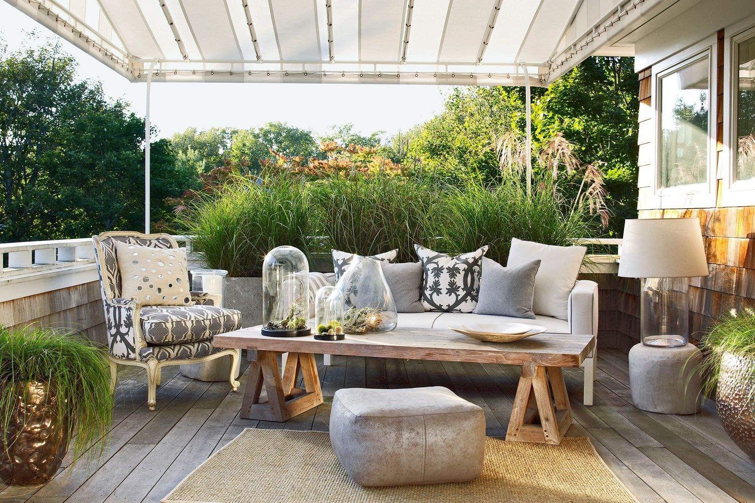 a patio with a canopy over the couch and table