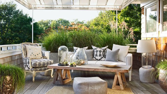 a patio with a canopy over the couch and table