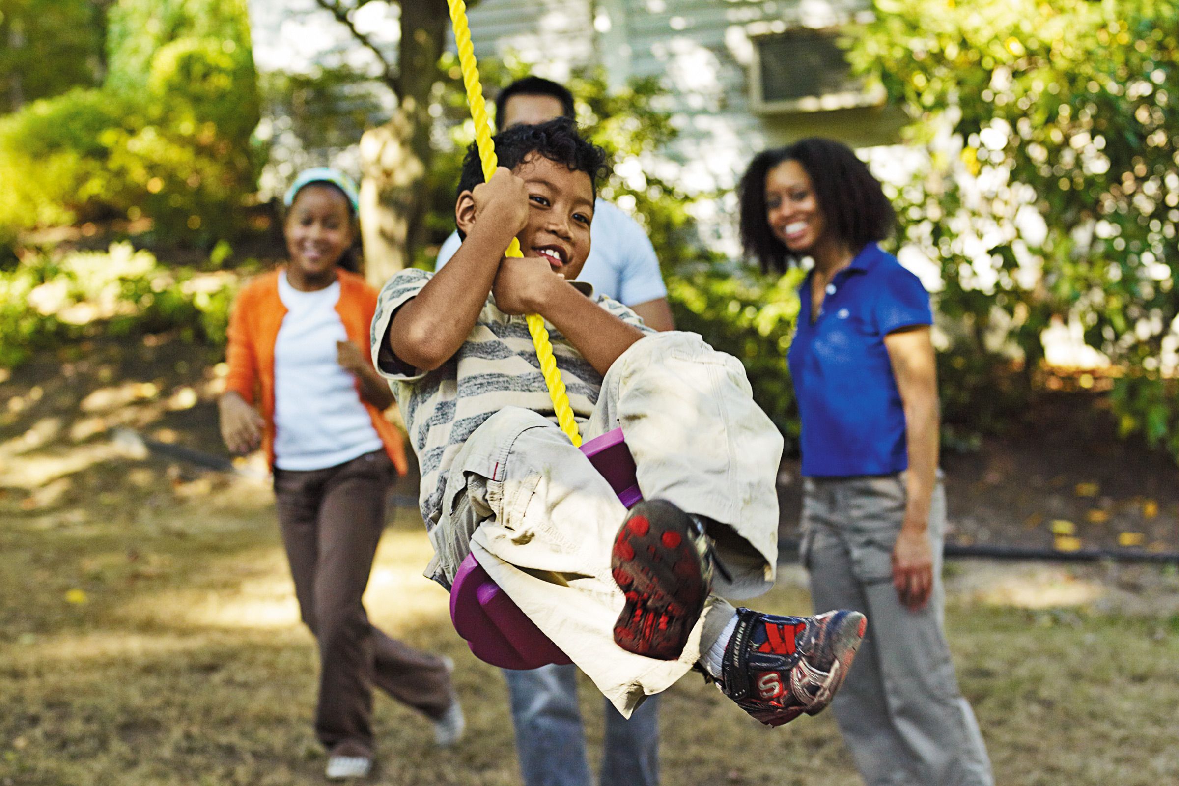 a kid on a tree swing