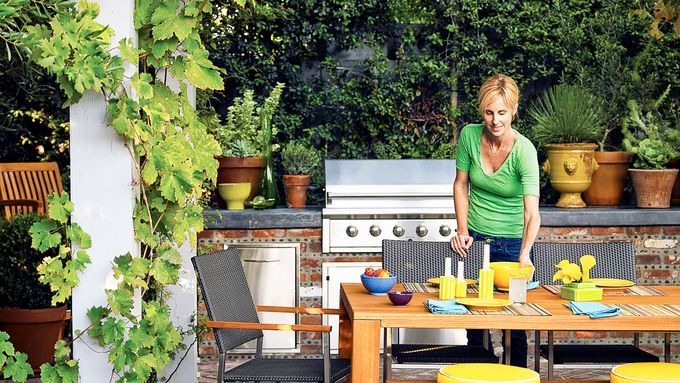 An outdoor kitchen with a dining area.