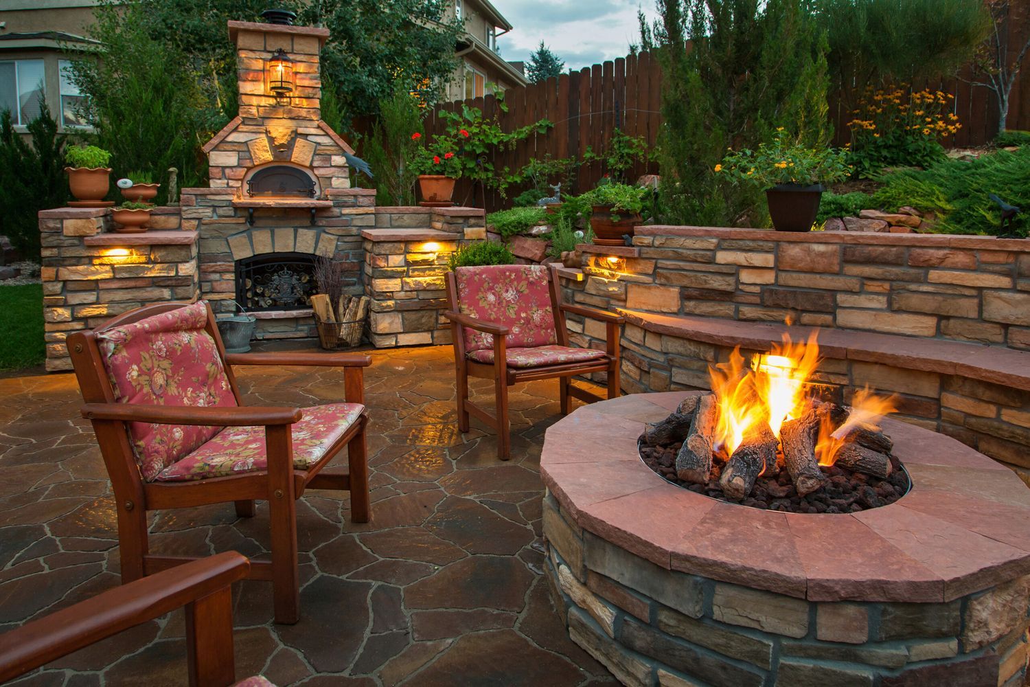 An outdoor fire pit surrounded by chairs.