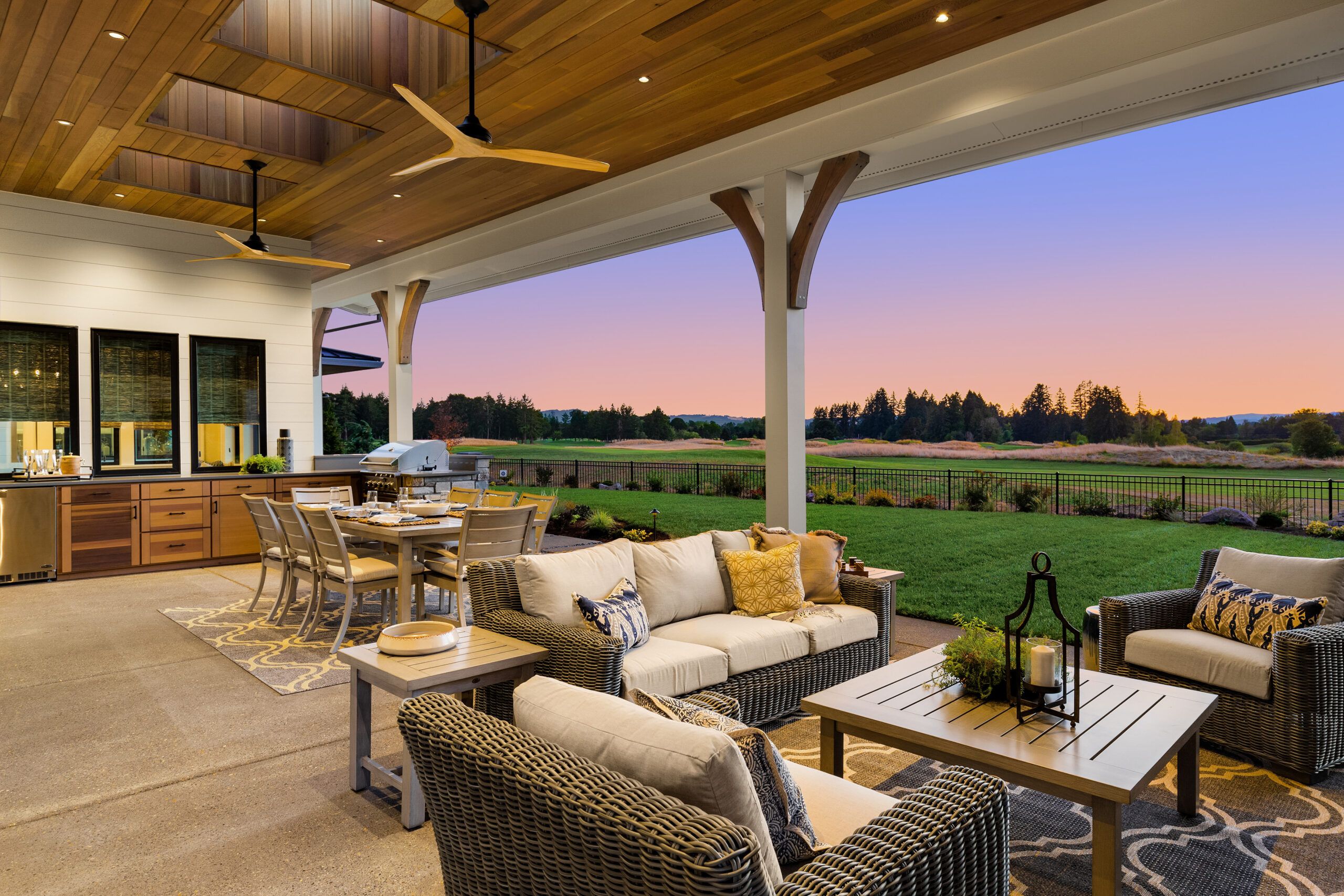 An outdoor kitchen with a dining area.