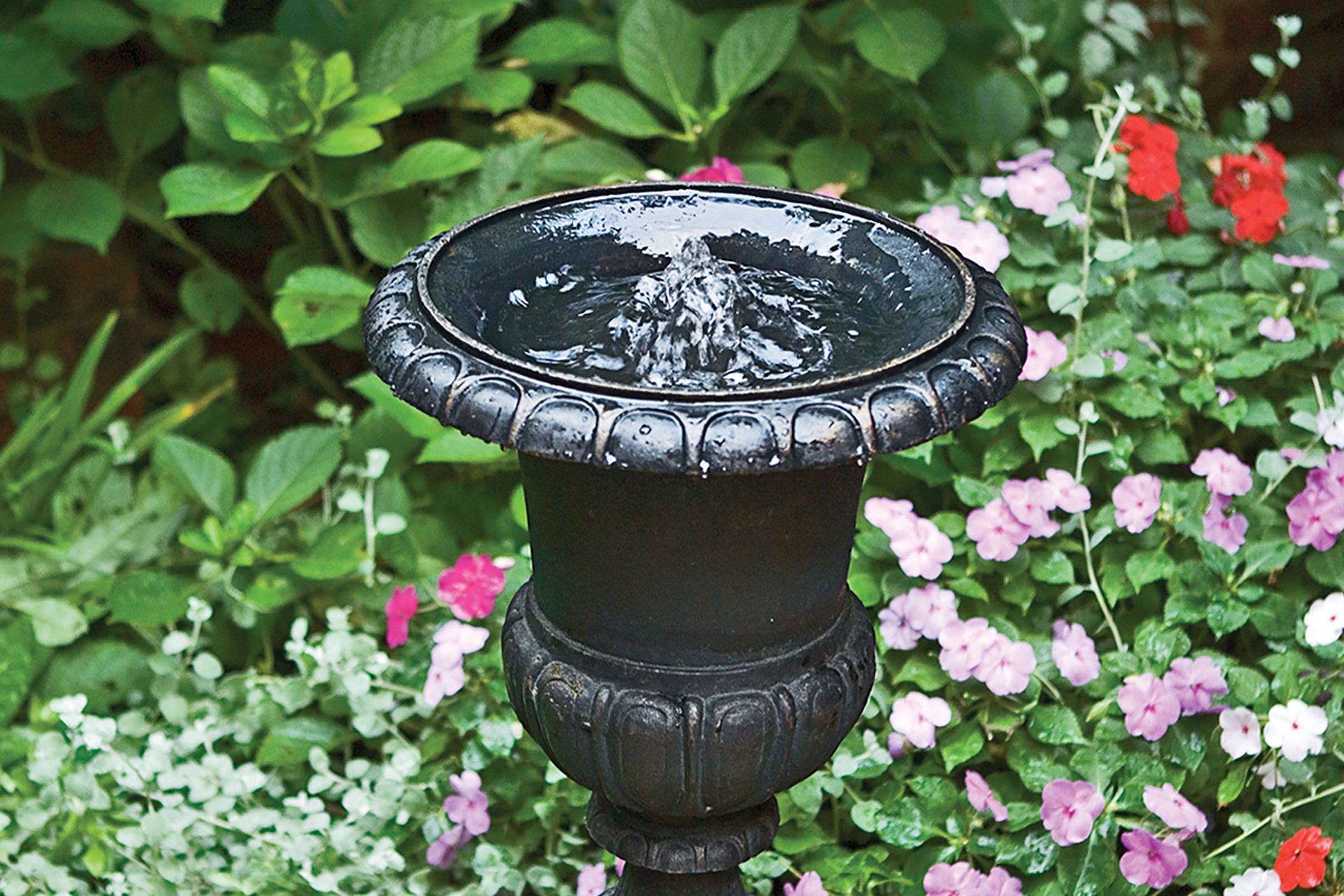 Garden fountain built from a salvaged urn.